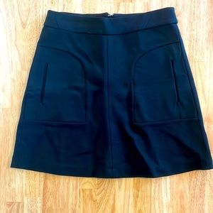 Anthropologie Maeve black mini skirt with side pockets. Size 6